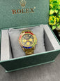 Rolex Daytona rainbow in golden strap